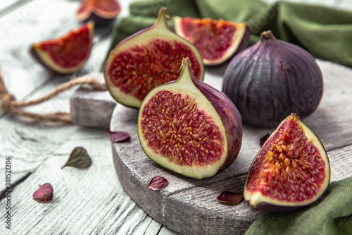 Juicy ripe figs. Whole fruit and cut into halves. Healthy, fortified, dietary food.