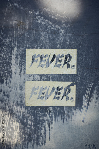  Gray wall with white painted places and fever stickers