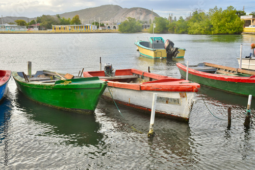 Fototapeta Naklejka Na Ścianę i Meble -  Colorful fishing boats tied up in the harbor in Guanica, Puerto Rico.