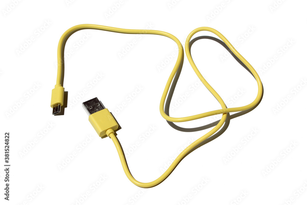 yellow USB cable on white background. USB and USB-mini cable connectors close-up. A patch cable or patch cord or patch lead. yellow USB cable on white background. USB and USB-mini cable connectors close-up. A patch cable or patch cord or patch lead.