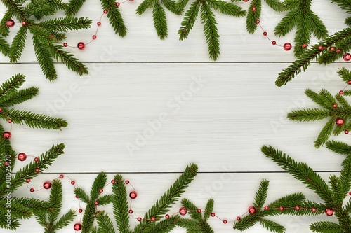 New year, Christmas. Spruce branches with free space in the center for your inscription. Background, frame, design, creative, holidays.