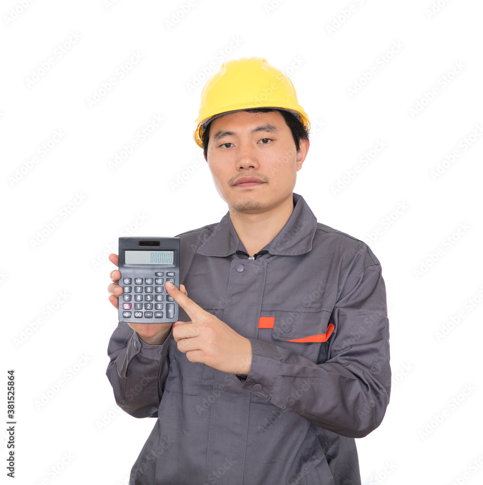 Migrant worker holding calculator standing in front of white background Migrant worker holding calculator standing in front of white background