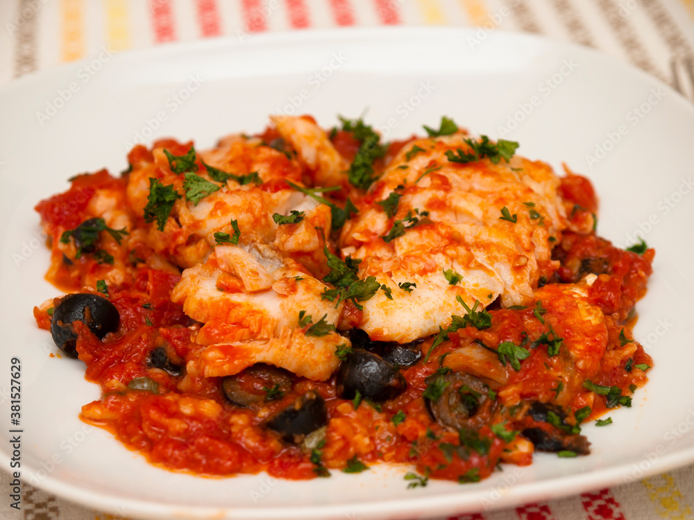 Baccalà alla napoletana - neapolitan cod with tomato sauce Baccalà alla napoletana - neapolitan cod with tomato sauce