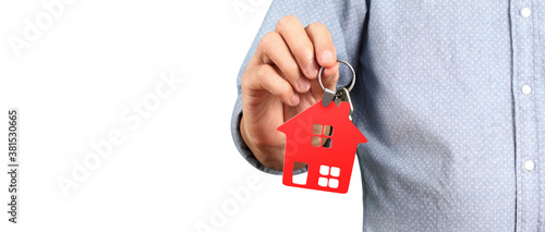 Real estate agent handing over house keys