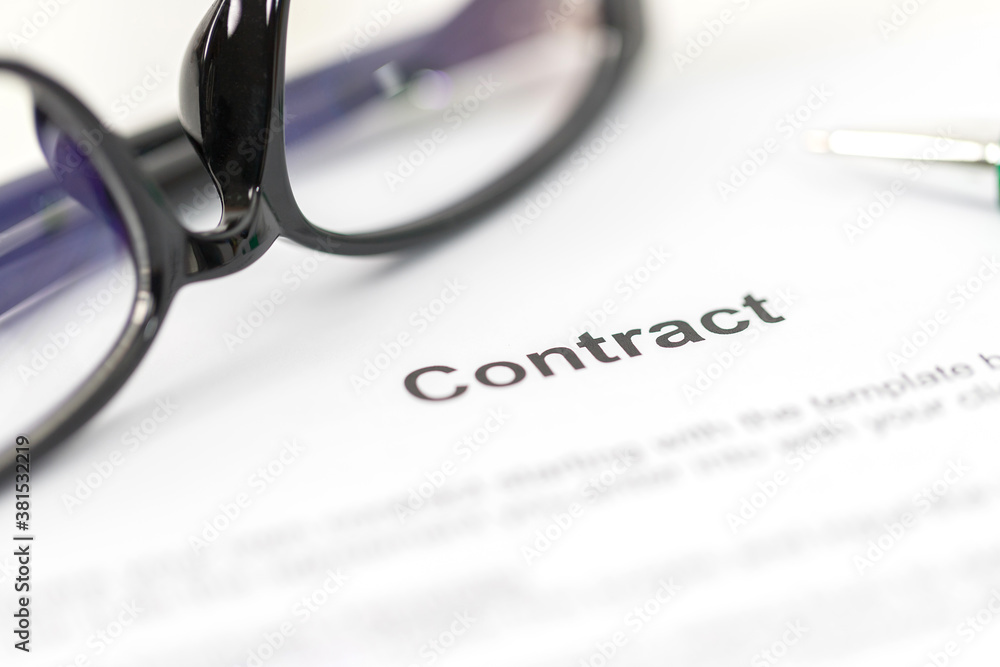 Sign on contract document with fountain pen and glasses Sign on contract document with fountain pen and glasses