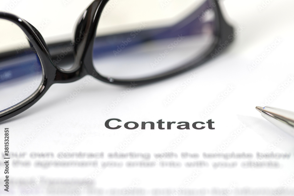 Sign on contract document with fountain pen and glasses Sign on contract document with fountain pen and glasses