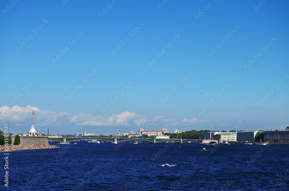 St. Petersburg view of the bridge, The Petropavlovsk Fortress and the Hermitage from the Neva River, boats float on the river