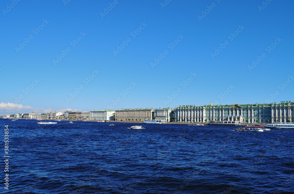St. Petersburg view from the Neva River to the Winter Palace and embankment, along the coast moored tour boats
