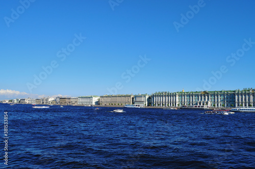 St. Petersburg view from the Neva River to the Winter Palace and embankment, along the coast moored tour boats © Svetlana