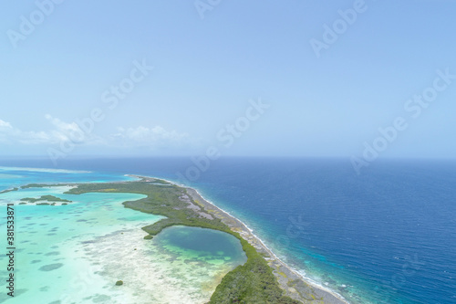 Aerial Landscape Caribbean island with shore coast of various shades of blue in Los Roques, National Park