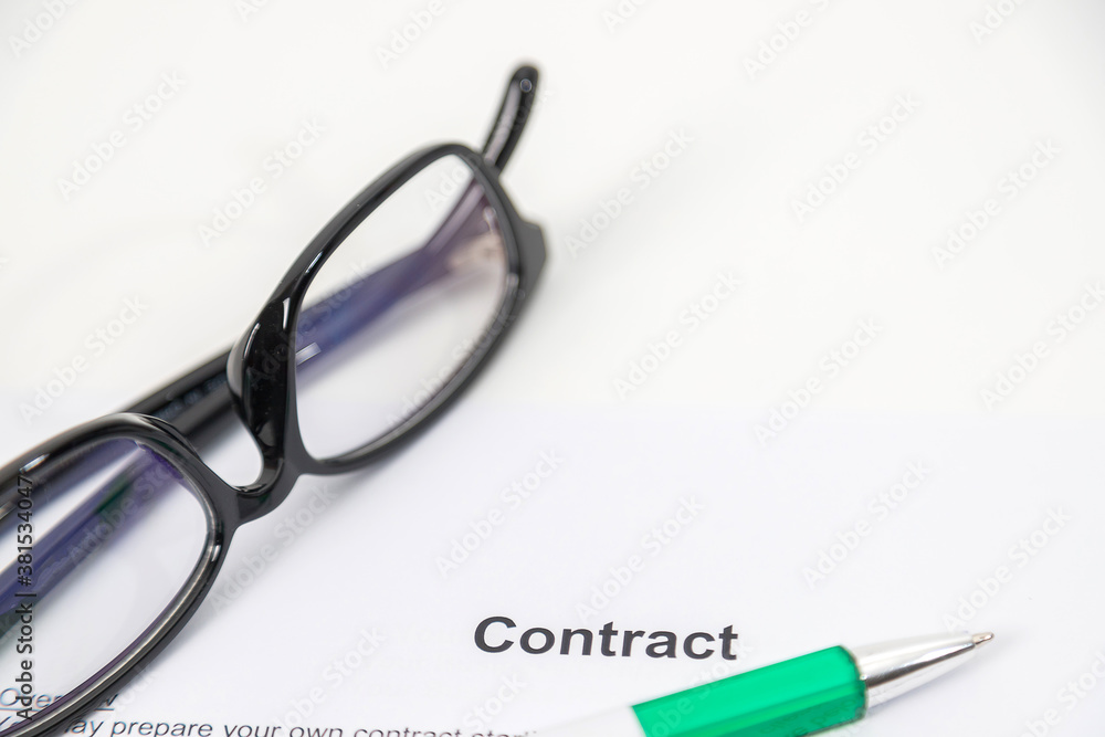 Sign on contract document with fountain pen and glasses Sign on contract document with fountain pen and glasses