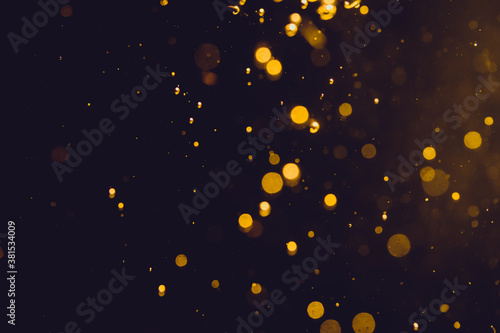 Dark Abstract Gold bokeh sparkle on black