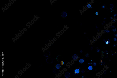 Abstract Blue bokeh of lights on black