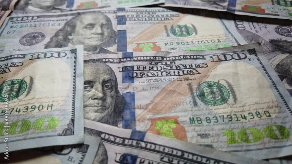 Hundred dollar benjamin franklin bills slow pan across money. Business and financial concepts for abundance and American US dollar federal reserve. Colorful moving money background. Economics. Hundred dollar benjamin franklin bills slow pan across money. Business and financial concepts for abundance and American US dollar federal reserve. Colorful moving money background. Economics.