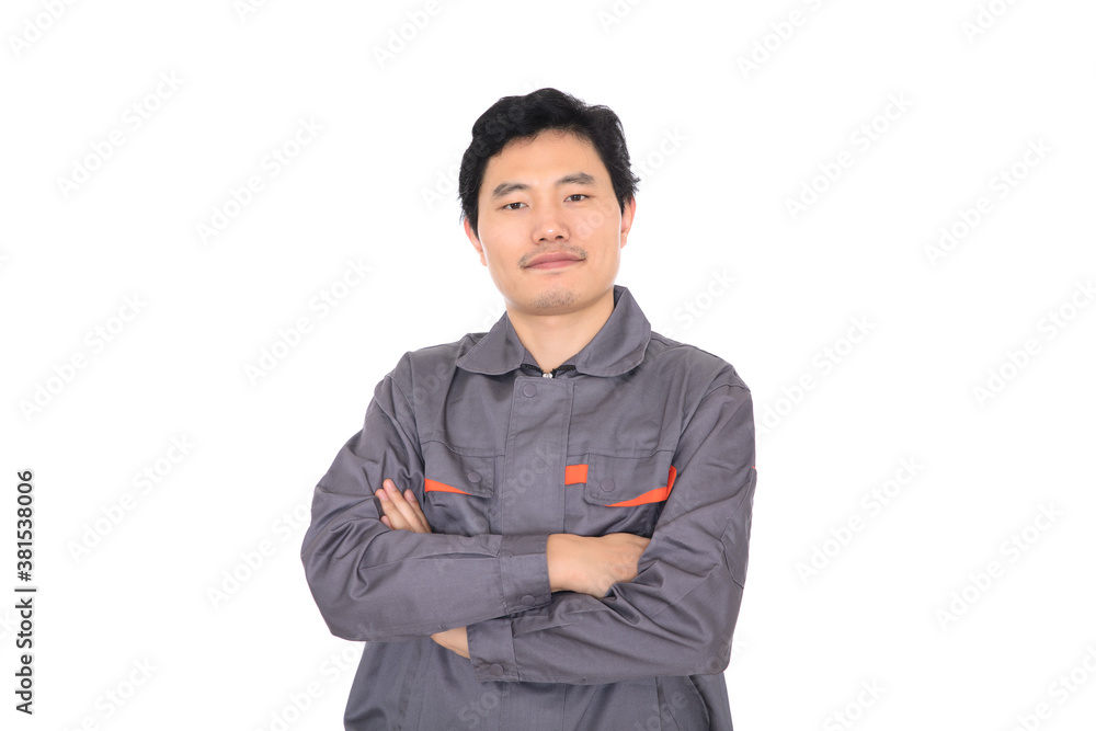 Male worker holding hands standing in front of white background Male worker holding hands standing in front of white background