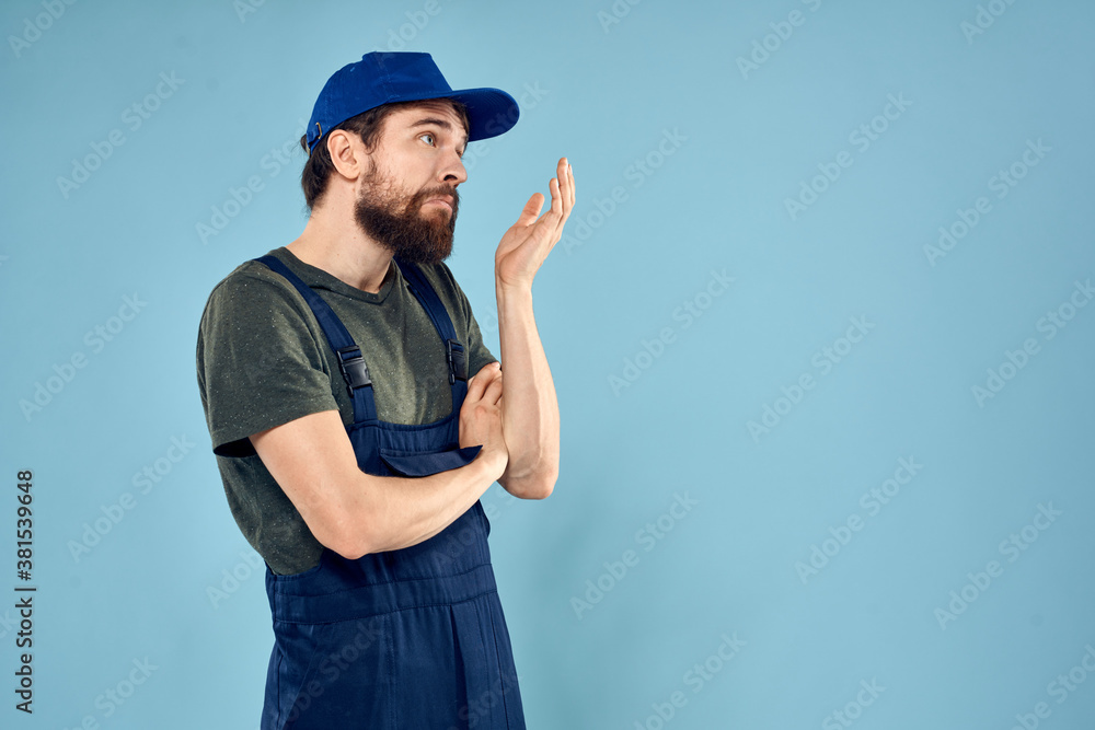 man in work uniform uniform professional work lifestyle delivery service blue background man in work uniform uniform professional work lifestyle delivery service blue background