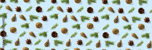 Pine cone Christmas background on blue. Pine branches and cones. minimal creative cone arrangement pattern. flat lay, Modern christmas Background.