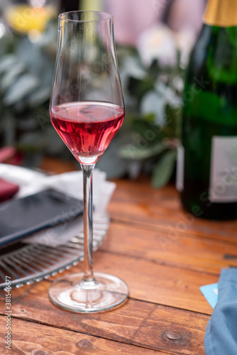Glass of wine on table with blurred background