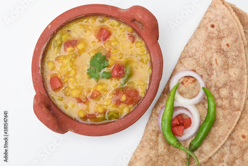 Indian flat bread Chapati and Spicy dal fry or dhal curry, roti made of whole wheat flour,  Jaipur Rajasthan India. chapathi, fulka, paratha ,rumali roti photo