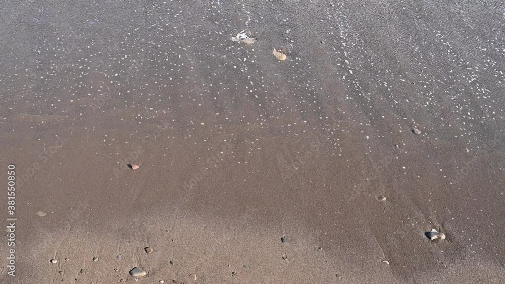 sea wave washing the sandy beach sea wave washing the sandy beach