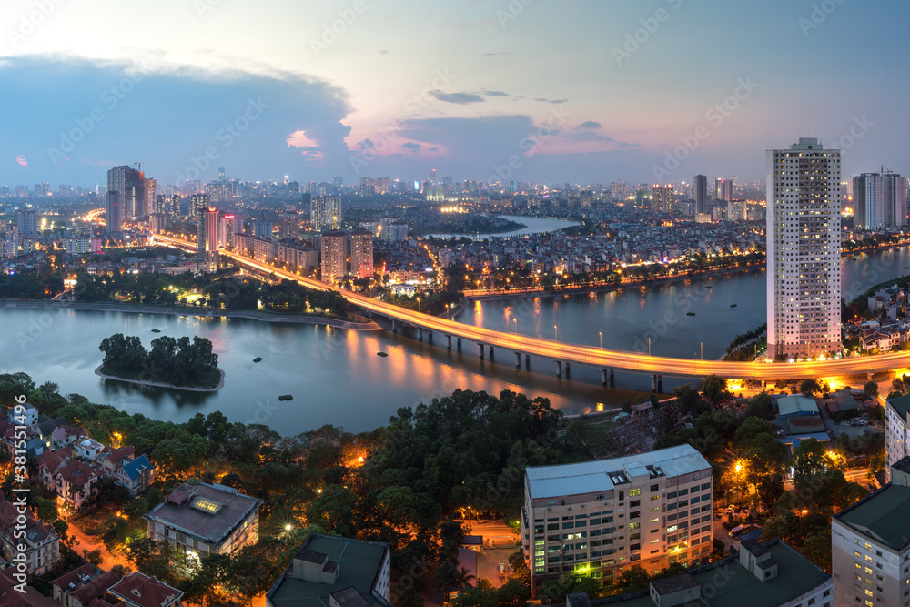 Obraz premium Aerial skyline view of Hanoi at Linh Dam lake, Belt Road No. 3. Hanoi cityscape by sunset period