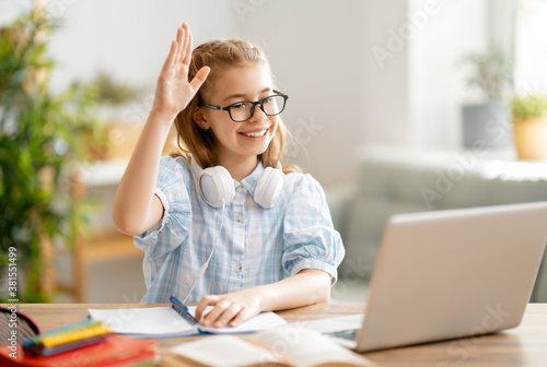 Girl doing homework or online education.