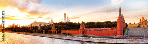 moscow kremlin landmark skyline panorama at sunset. Ultra wide panoramic view from moscow river embankment against moscow city skyscrapers on background. Historic moscow city landscape