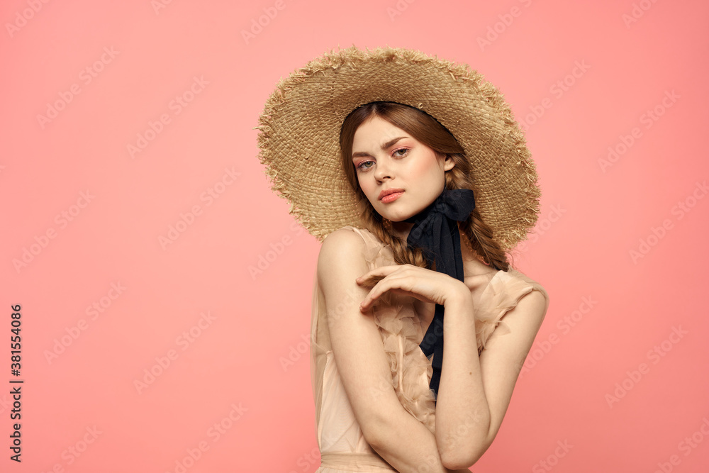 Romantic girl with pigtails and in a straw hat smile romance pink background Copy Space Romantic girl with pigtails and in a straw hat smile romance pink background Copy Space