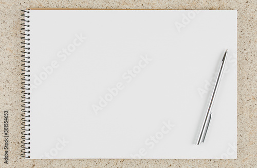 open notebook with pen on the table top view