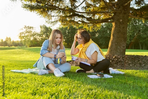 Outdoor meeting of teenage girl and woman of psychologist social worker