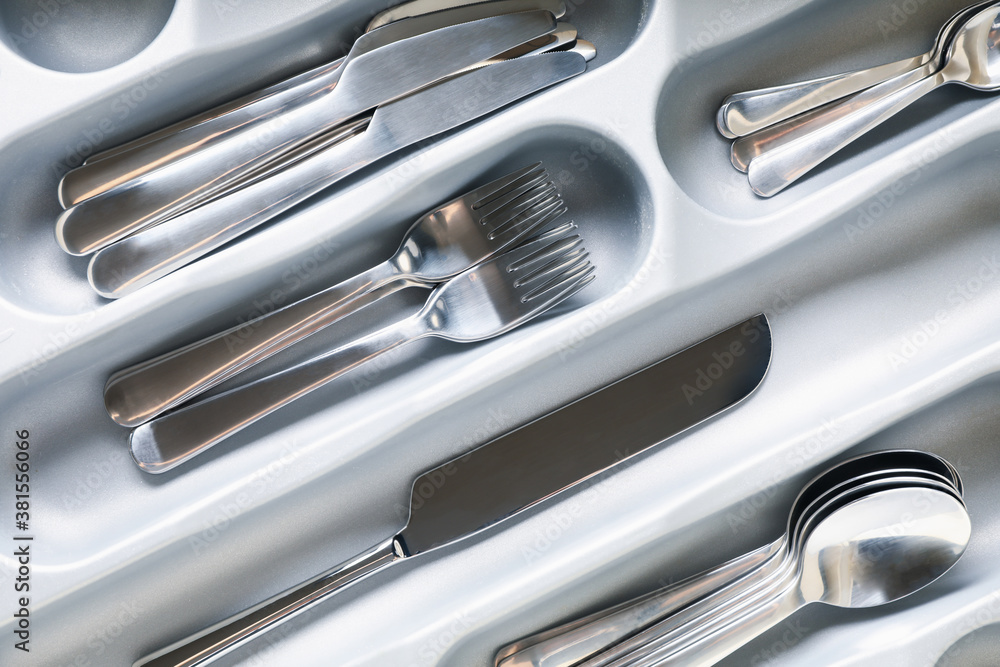 Set of different cutlery on whole background, close up Set of different cutlery on whole background, close up