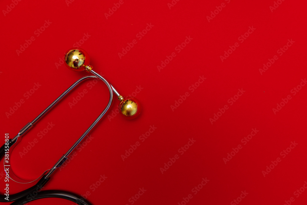 Medical Christmas banner with stethoscope on red background. 