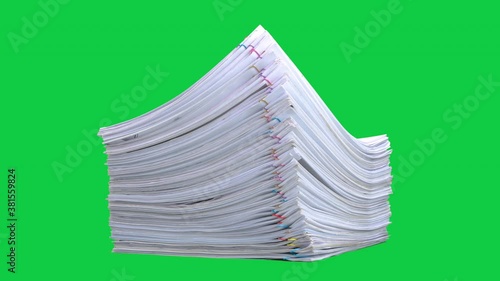 Stop motion animation Stacks overload document paper files on chroma key green screen background. Alpha Channel.