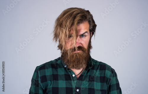 Mens beauty and health. mature charismatic male. guy with beard and moustache. confidence and charisma. bearded man wearing casual checkered shirt. hair beauty and fashion