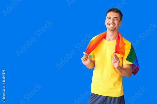 Young man with LGBT flag on...