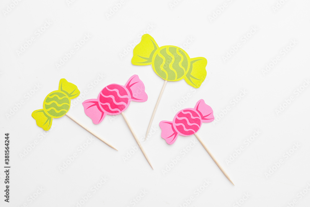 Stylish cupcake toppers on white background Stylish cupcake toppers on white background