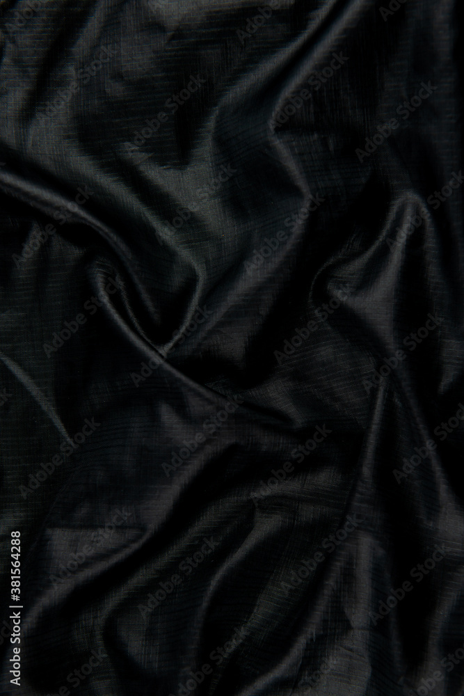 Black abstract background cloth and luxury liquid waves silk texture satin material Black abstract background cloth and luxury liquid waves silk texture satin material