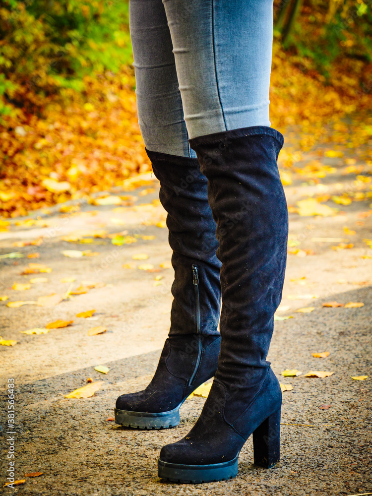 Woman wearing black knee high boots