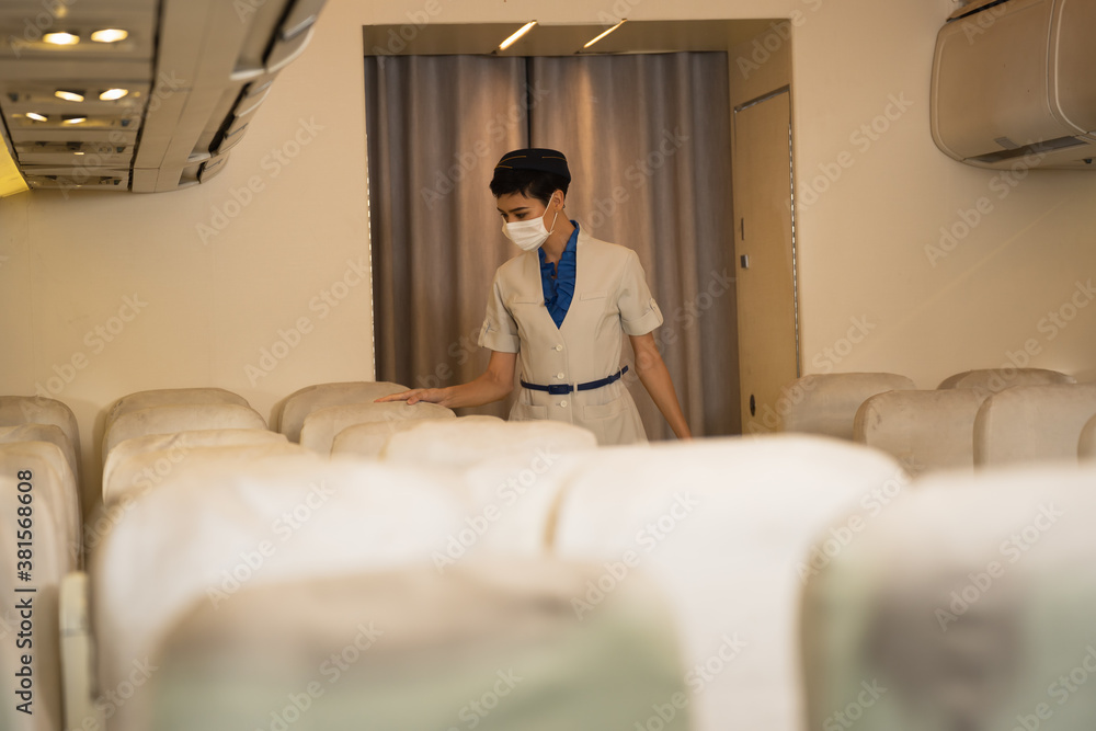 Female crew completes inspection Accepting passengers who are about to leave for travel, monitor social distances. And wearing a mask Female crew completes inspection Accepting passengers who are about to leave for travel, monitor social distances. And wearing a mask