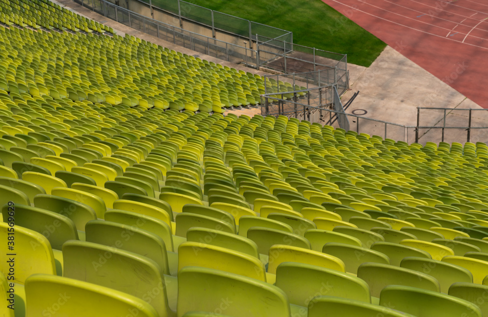 Naklejka premium endless rows of enpty chairs in a stadium