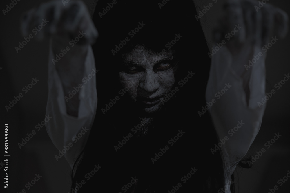 Horror woman ghost creepy stand lift 2 hands on the house, halloween day concept