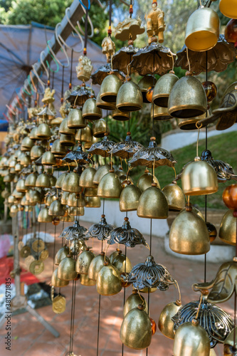 Wallpaper Mural Closeup view of many beautiful old fashioned golden Christmas bells hanging as new year toys, horizontal picture Torontodigital.ca