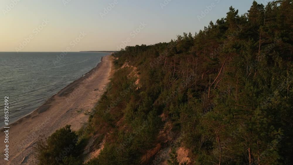 Aerial forward: Beautiful sunset at Baltic Sea with latvian forest and sand precipice Aerial forward: Beautiful sunset at Baltic Sea with latvian forest and sand precipice