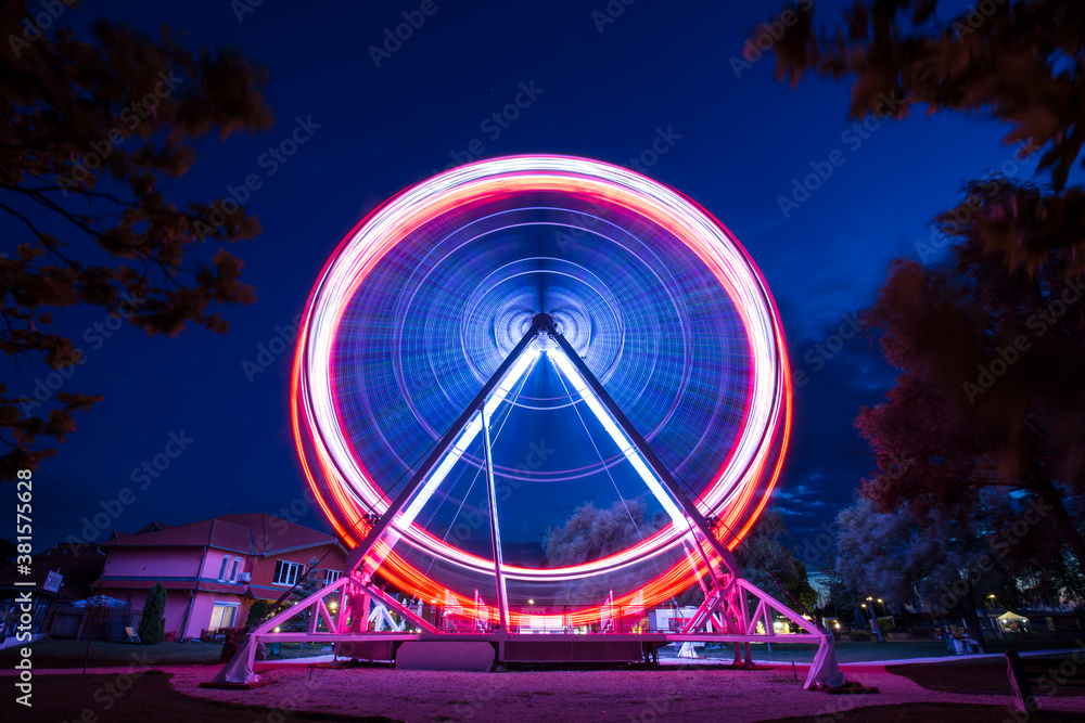 Ferris wheel go around at Lake Balaton at night