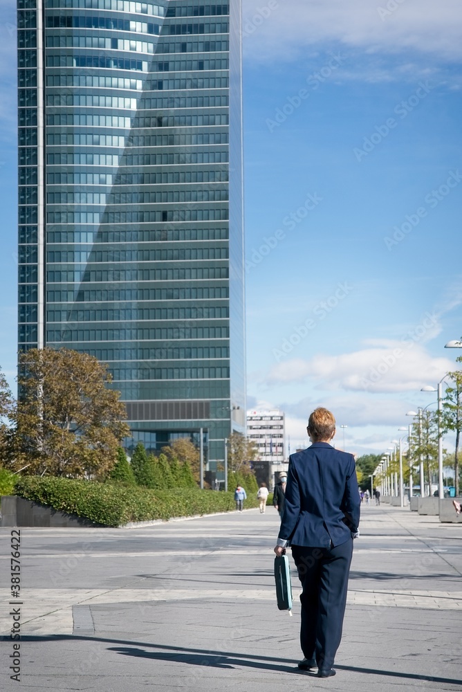 businesswoman walking on the street businesswoman walking on the street