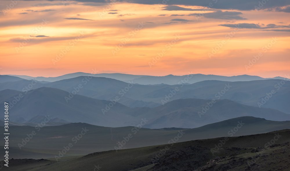 Steppe in Mongolia with Sunset and Orange Clouds