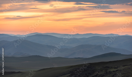 Steppe in Mongolia with Sunset and Orange Clouds