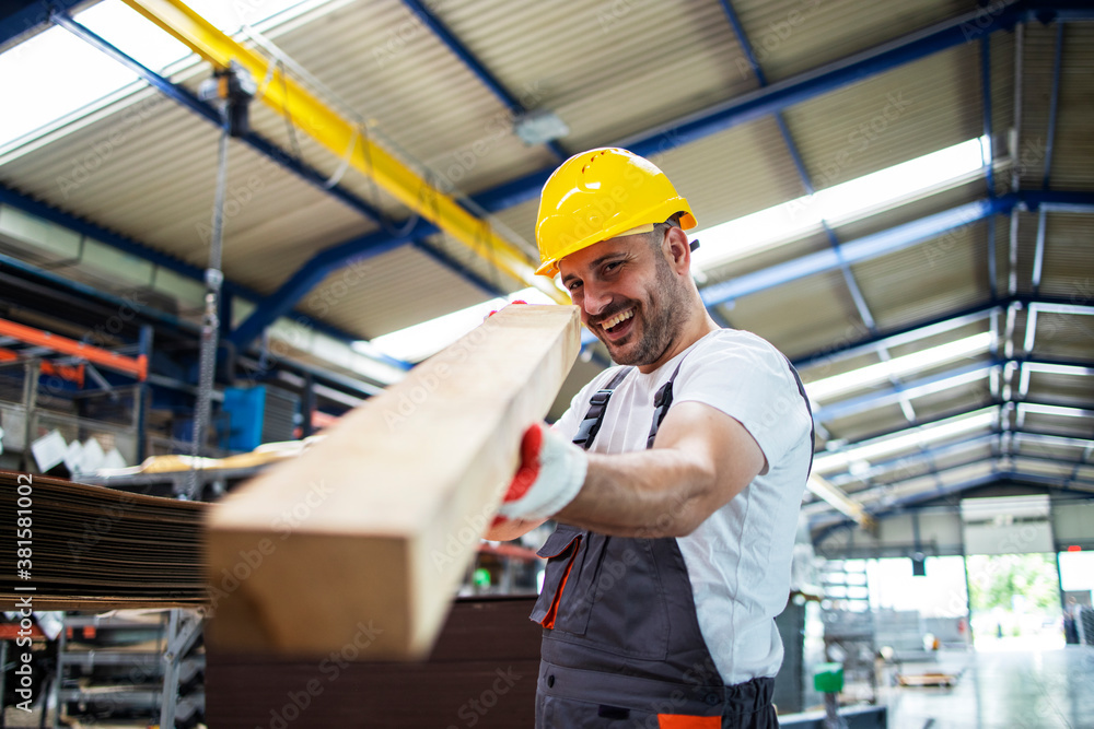 Factory worker checking wood material for further production. Wood industry. Factory worker checking wood material for further production. Wood industry.