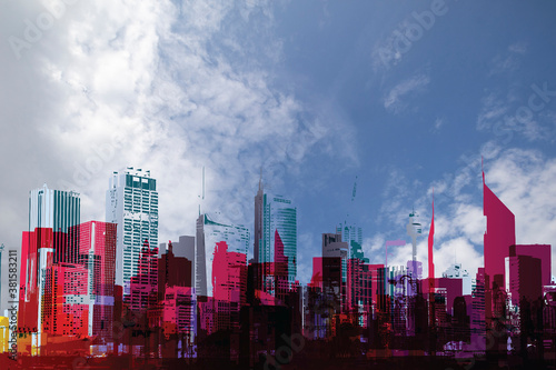 Generic abstract silhouetted urban city skyline set against a blue cloudy daytime sky