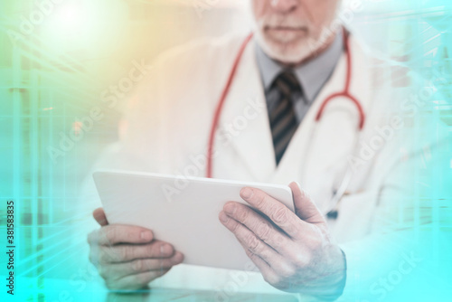 Male doctor using digital tablet  multiple exposure